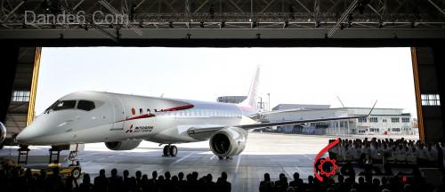 The Mitsubishi Regional Jet (MRJ) passenger aircraft, developed by Mitsubishi Aircraft Corp., is unveiled during a rollout ceremony at Mitsubishi Heavy Industries Ltd.'s Nagoya Aerospace Systems Works Komaki South Plant in Toyoyama, Aichi Prefecture, Japan, on Saturday, Oct. 18, 2014. Japan unveiled its first passenger jet today after a delay of almost four years, with a helping hand from bullet-train specialists as it prepares for test flights next year. Photographer: Kiyoshi Ota/Bloomberg